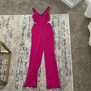 Pink jumpsuit with cutouts on the side